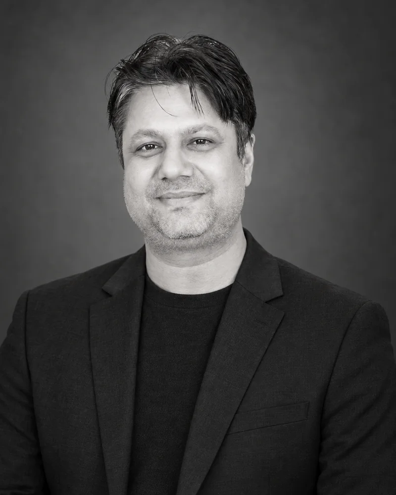 Black-and-white portrait of Gulshan K.